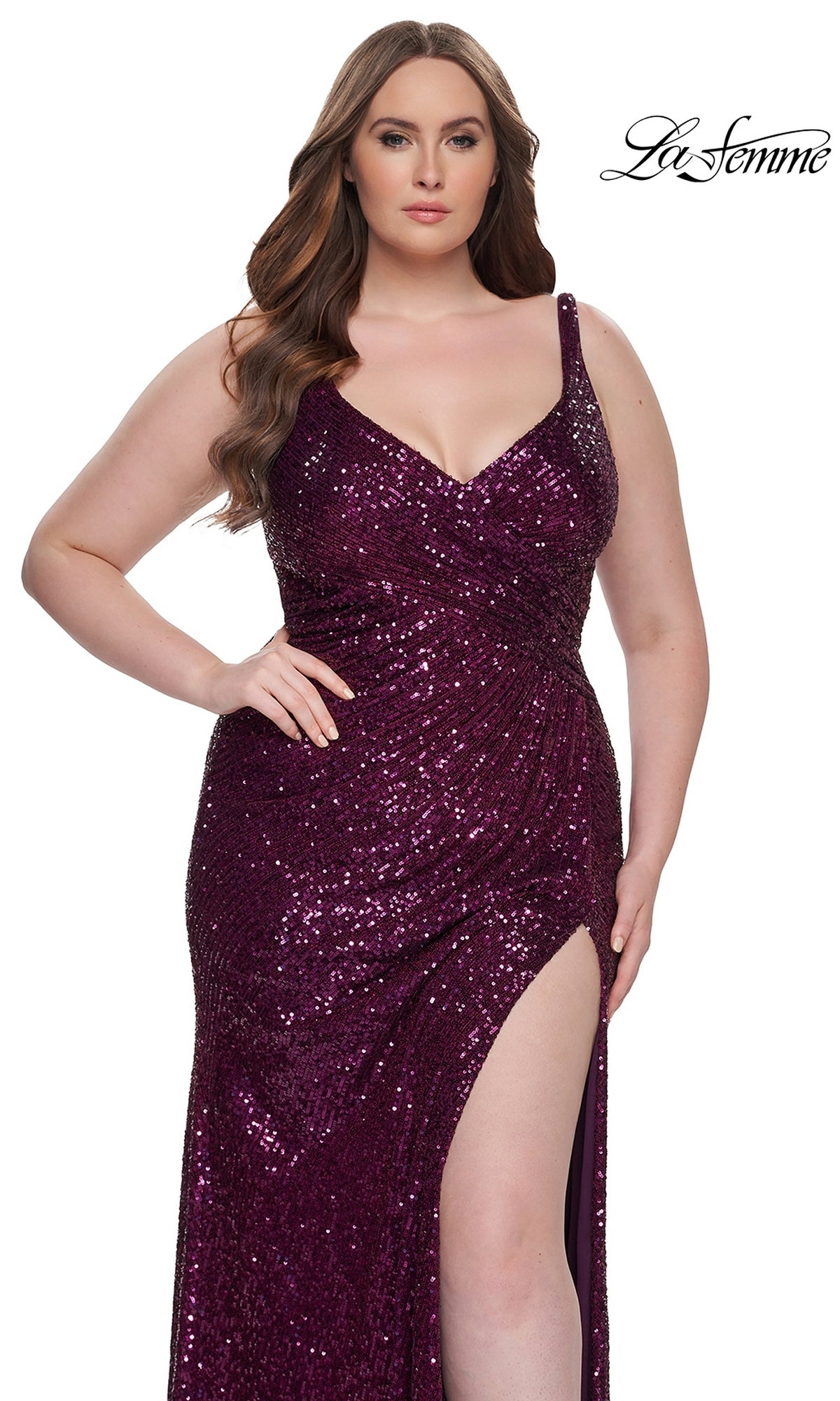 A woman wears the La Femme Long Prom Dress 31138—a sleeveless, deep purple gown with sequins, V-neckline, and thigh-high slit. The La Femme logo is in the top right corner.